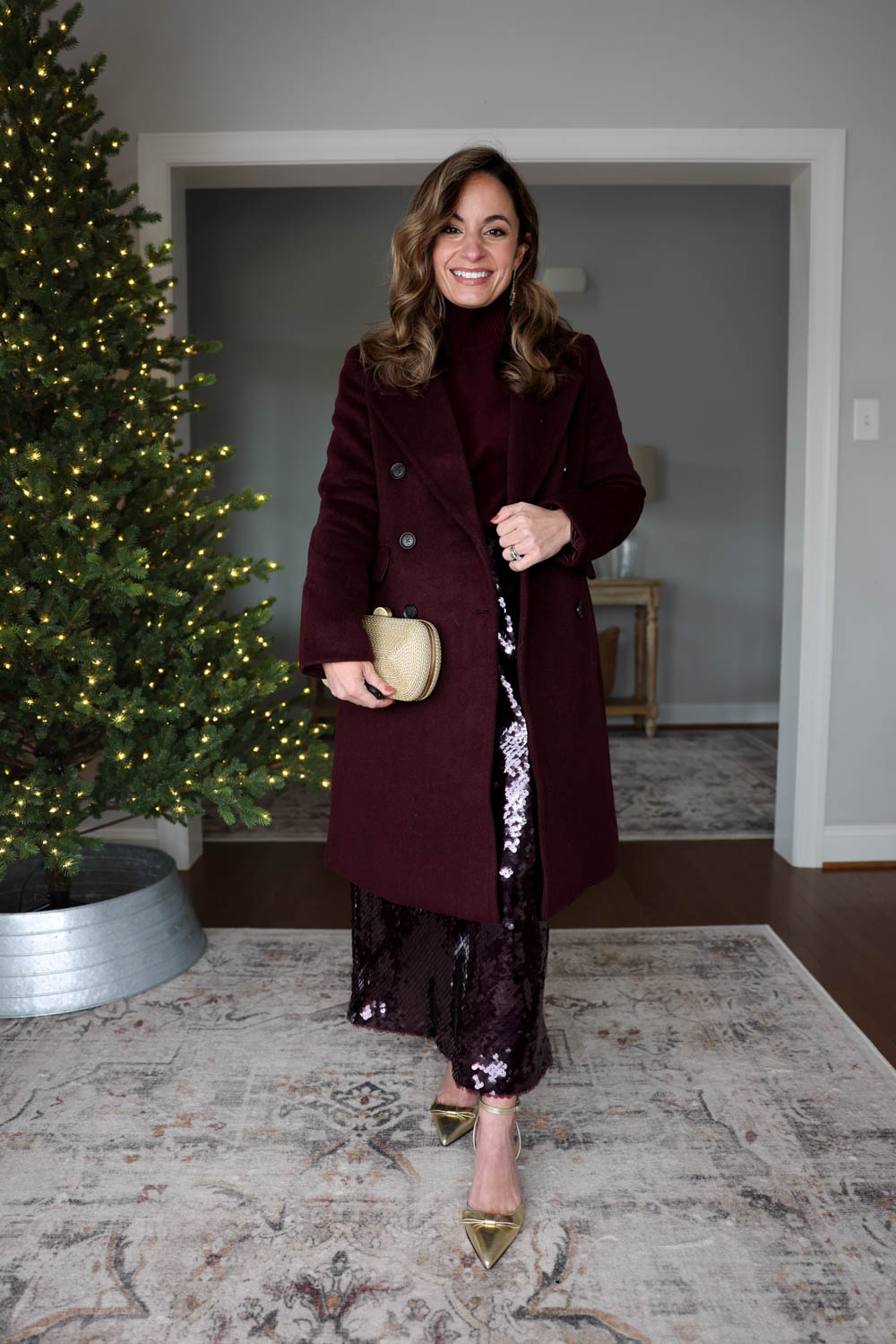 Brooke of Pumps and Push-Ups wearing a Banana Republic Factory sequin midi skirt in size 0 with a turtleneck sweater in XXS and the Timeless Topcoat in Petite 00 for a tonal holiday outfit.